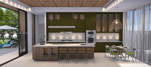 interior space with wood ceiling, decorative light fixtures, an island with sink, and a breakfast bar area