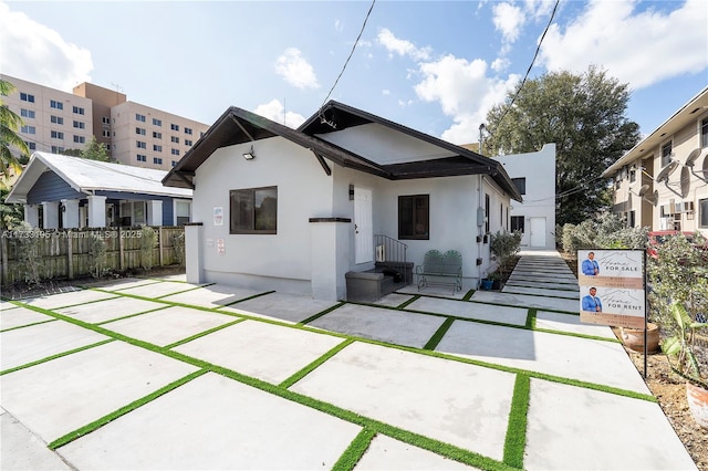 rear view of property featuring a patio area