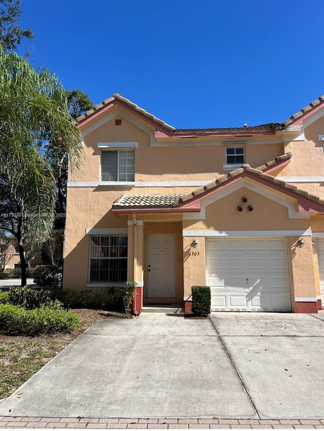 mediterranean / spanish-style home featuring a garage