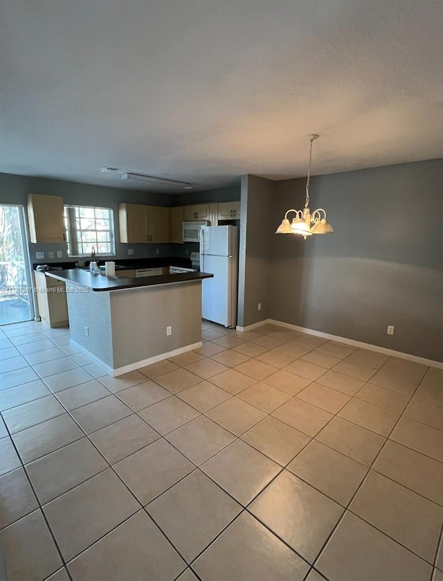 kitchen with a center island, a chandelier, light tile patterned floors, pendant lighting, and white appliances