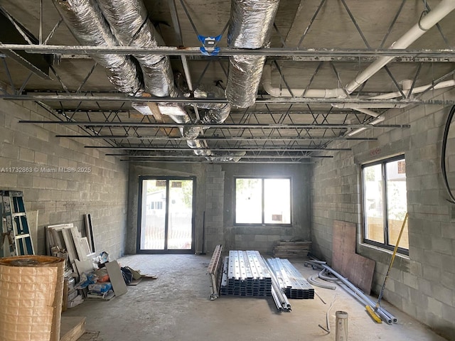 misc room with concrete flooring and plenty of natural light