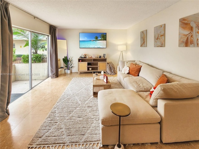 living room featuring tile patterned floors and a textured ceiling