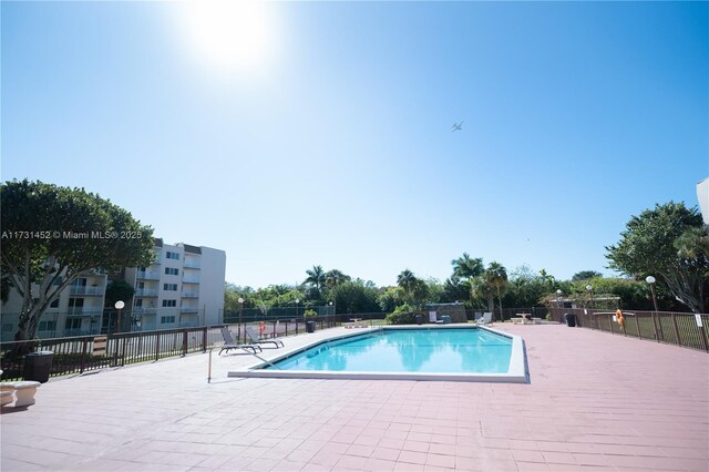 view of swimming pool featuring a patio area