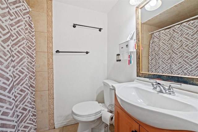 bathroom with a shower with curtain, vanity, tile patterned flooring, and toilet