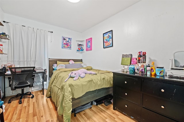 bedroom with light hardwood / wood-style floors