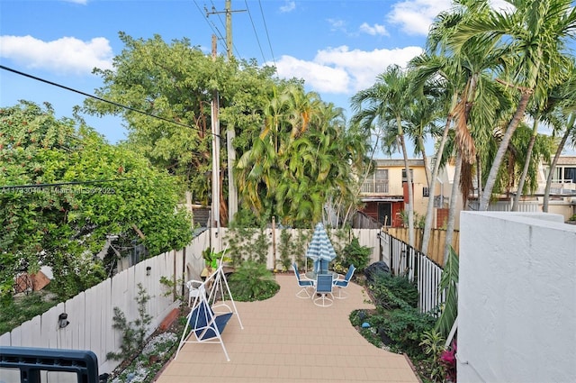 view of wooden balcony featuring outdoor dining space and a wooden deck