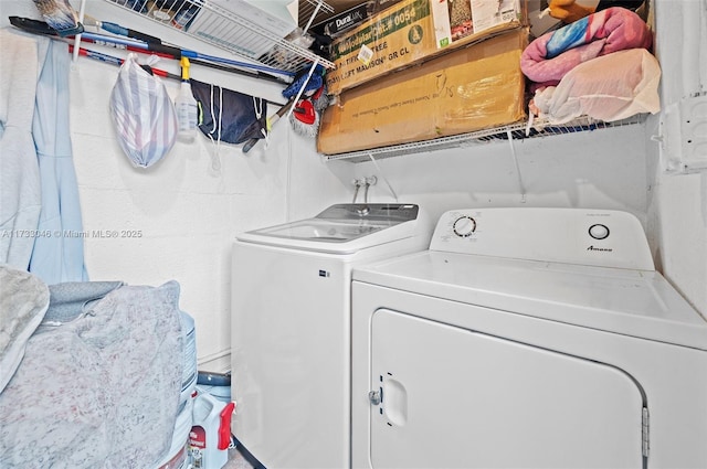 washroom with laundry area and washer and dryer