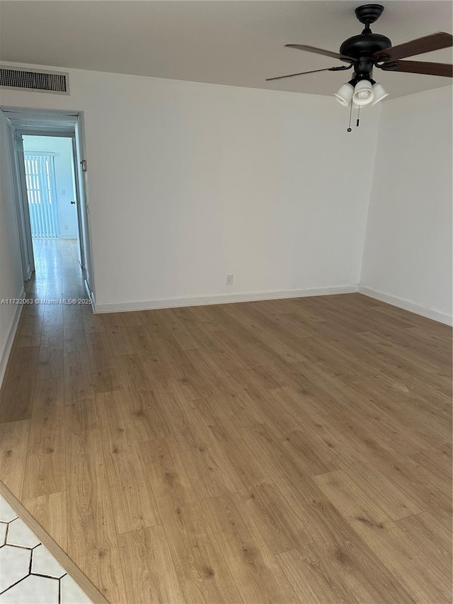 unfurnished room featuring ceiling fan and light hardwood / wood-style floors