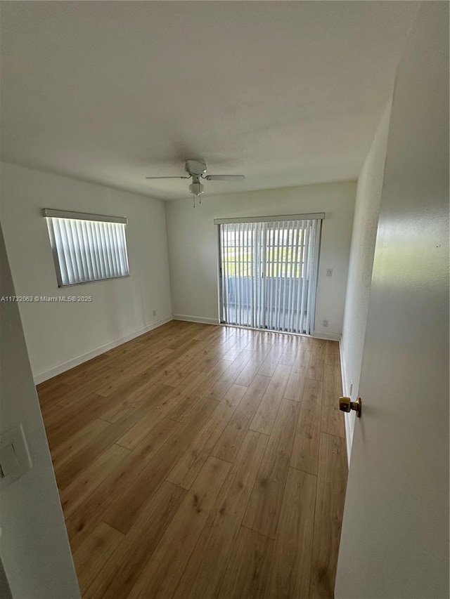 empty room featuring light hardwood / wood-style floors and ceiling fan