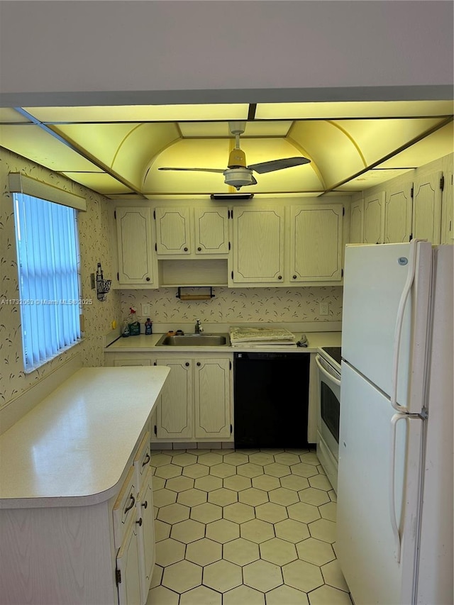 kitchen with sink and white appliances