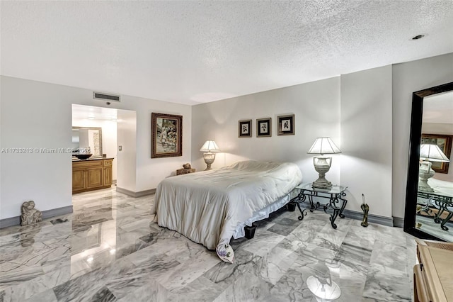 bedroom featuring a textured ceiling