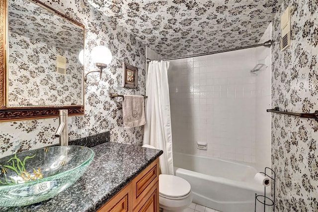 full bathroom featuring vanity, tile patterned flooring, shower / bath combo, and toilet