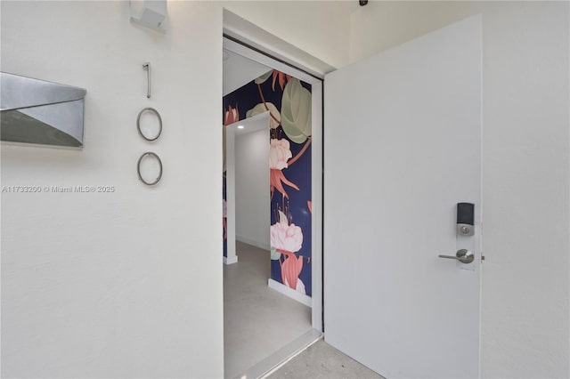 hallway featuring concrete flooring