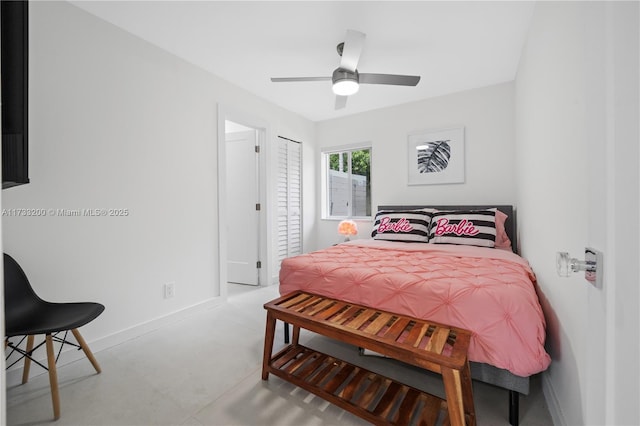 bedroom with a closet, concrete floors, and ceiling fan