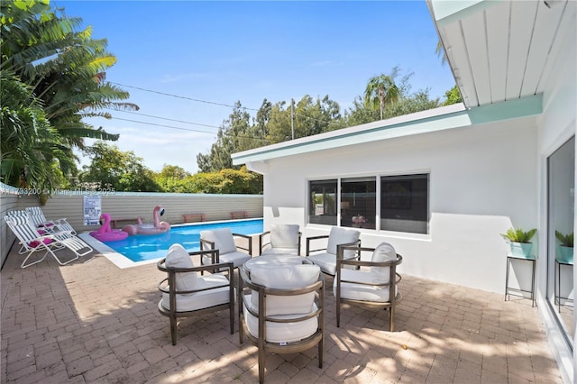 view of patio / terrace featuring a fenced in pool