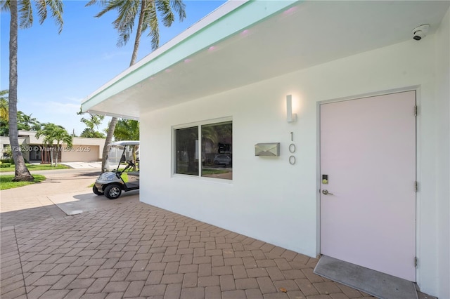 entrance to property featuring a patio area