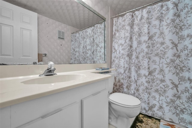 bathroom with vanity, toilet, and a shower with shower curtain