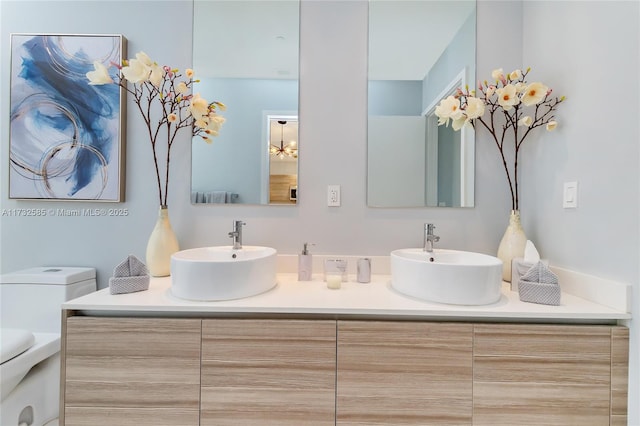 bathroom with vanity and toilet