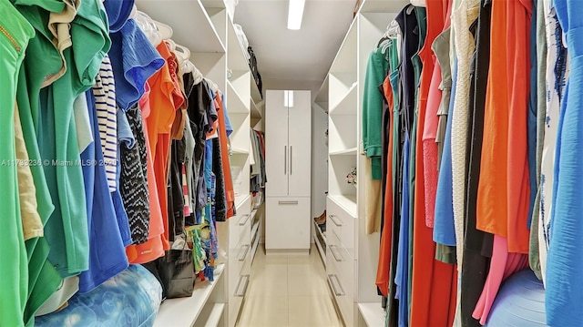 walk in closet featuring light tile patterned floors