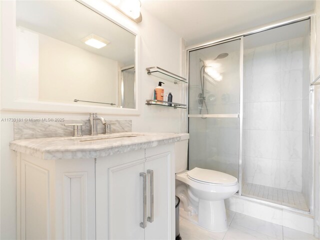 bedroom with crown molding, dark wood-type flooring, and ensuite bathroom