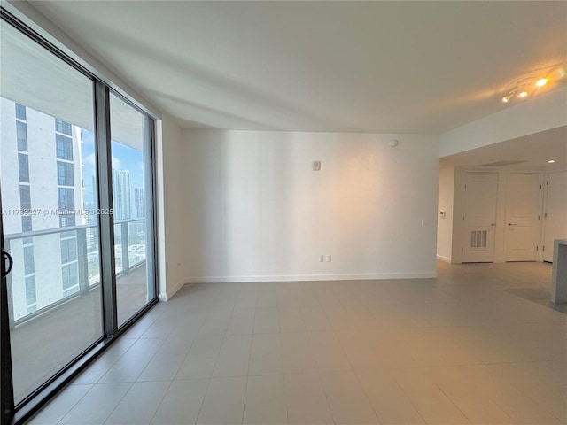 empty room featuring expansive windows