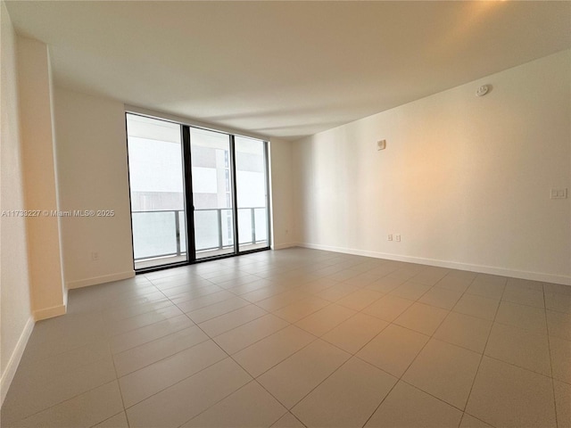 tiled empty room with expansive windows