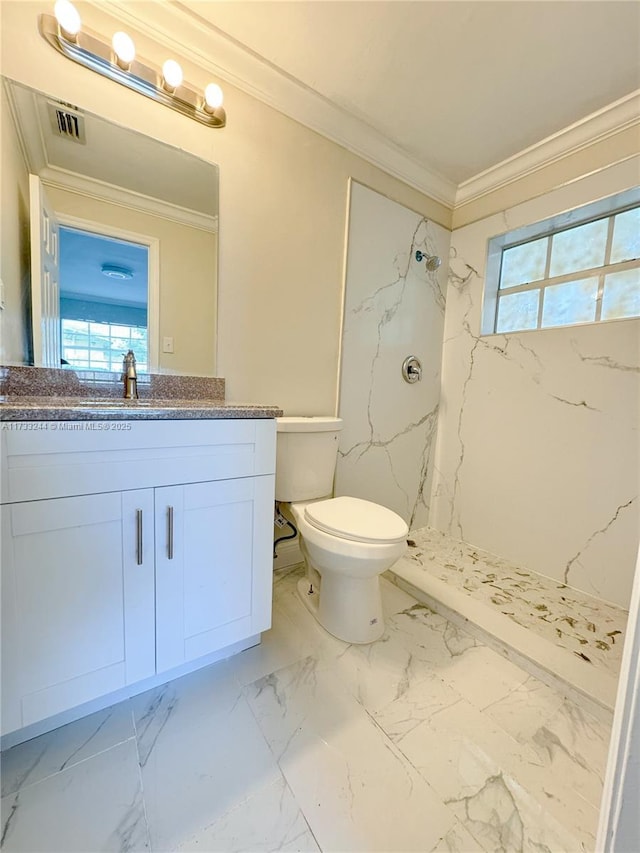 bathroom with vanity, ornamental molding, toilet, and a shower