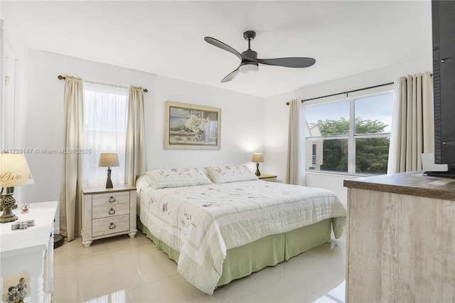 tiled bedroom with ceiling fan