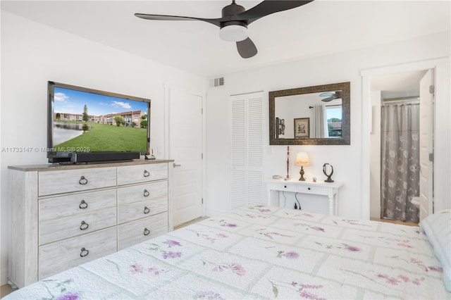 bedroom featuring ceiling fan and a closet