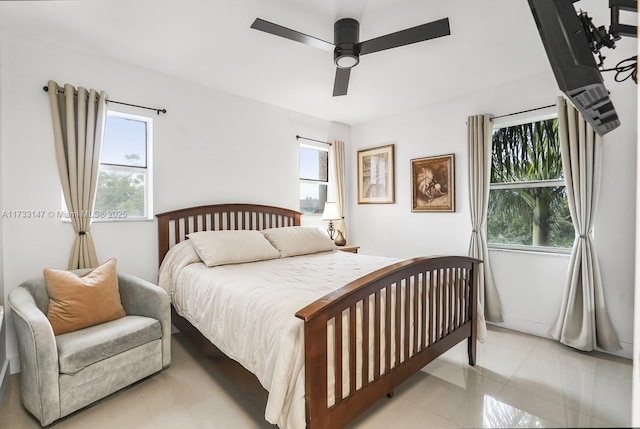 tiled bedroom with ceiling fan