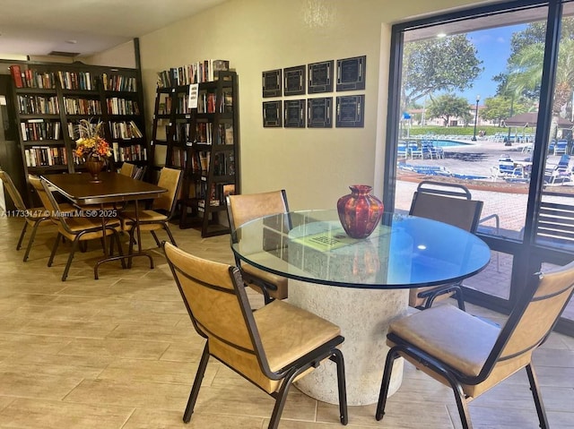 dining space with light hardwood / wood-style flooring