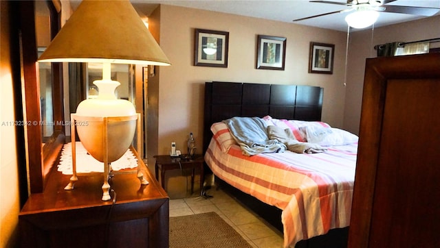 bedroom featuring light tile patterned floors and ceiling fan