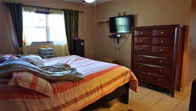 bedroom with light tile patterned floors