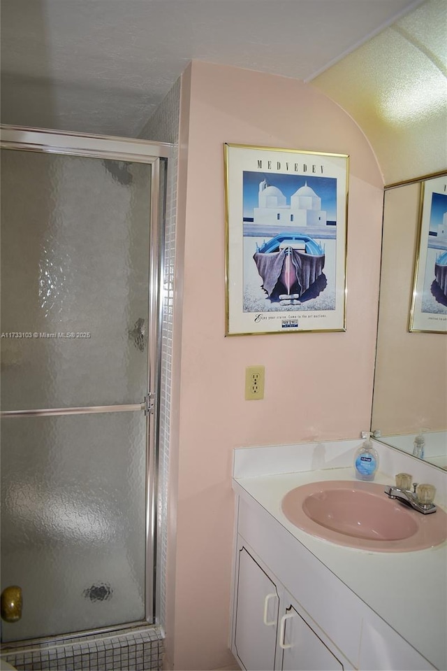 bathroom with vanity and walk in shower