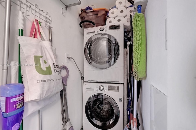 laundry room featuring stacked washer and dryer