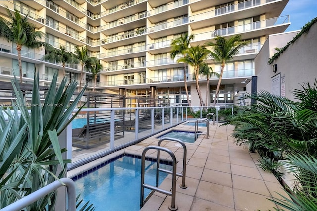 view of swimming pool with a patio area