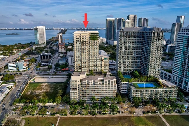 birds eye view of property with a water view