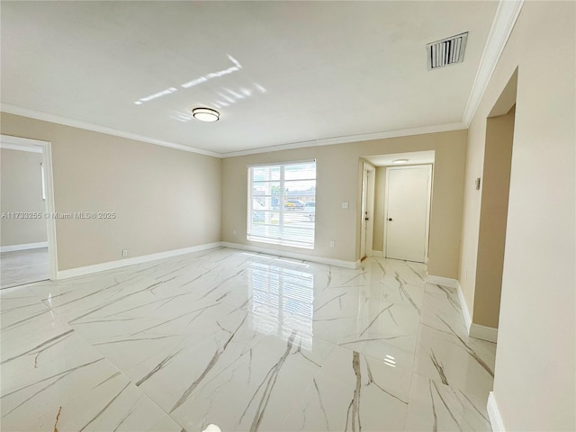 spare room with crown molding