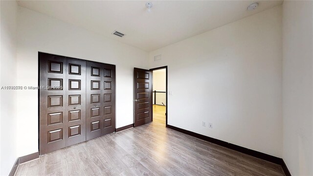 unfurnished bedroom featuring light hardwood / wood-style flooring