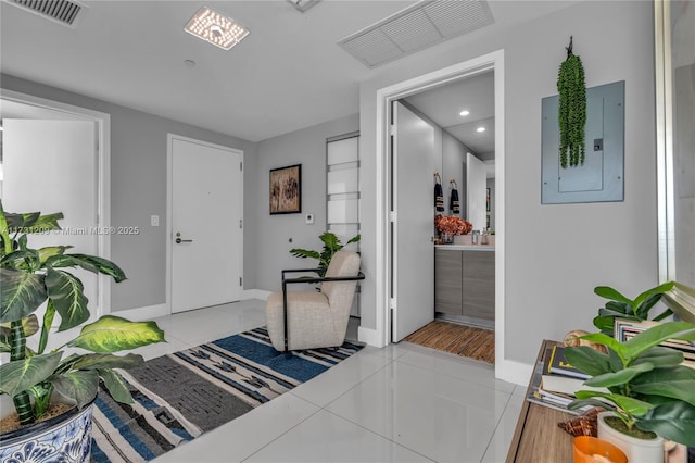 tiled foyer with electric panel