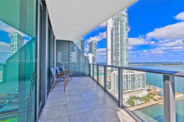 balcony featuring a water view