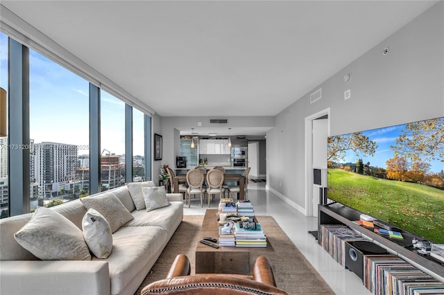 living room featuring a wall of windows