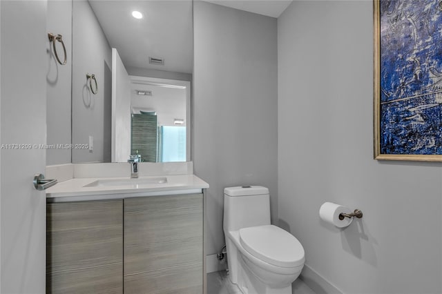 bathroom featuring vanity and toilet