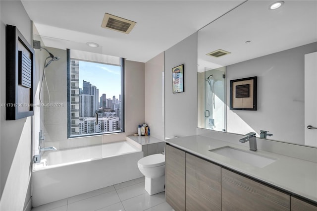 bathroom with vanity, tile patterned floors, and toilet