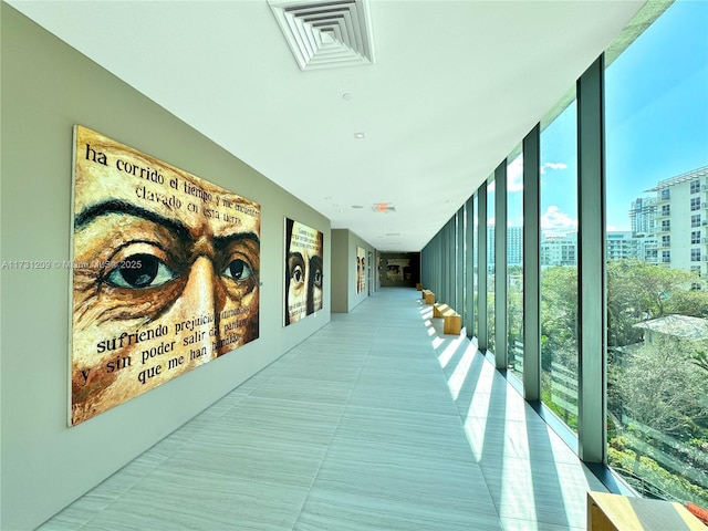 hallway featuring expansive windows