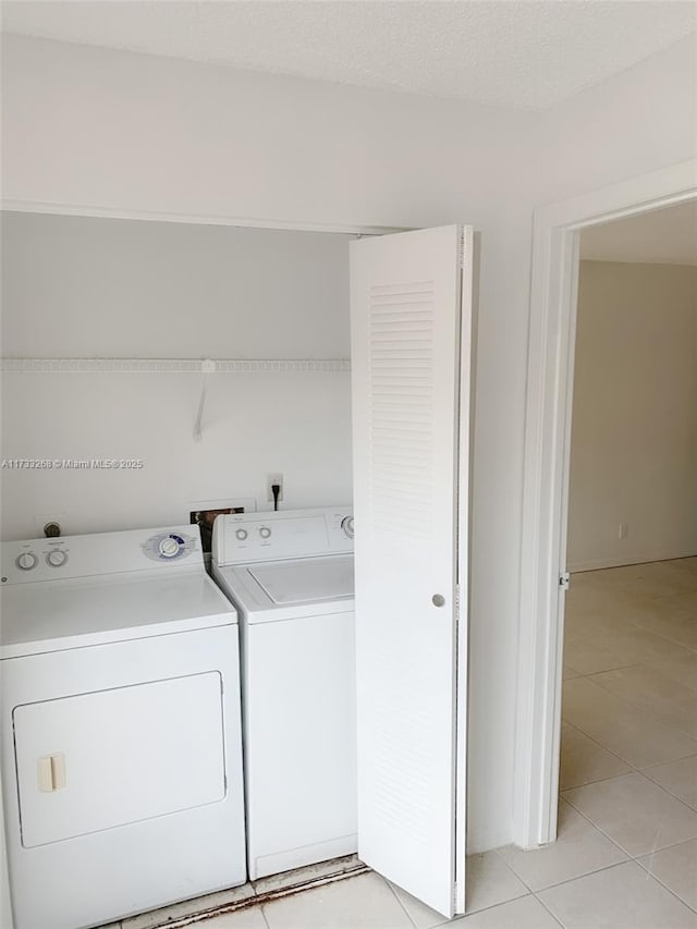 3360 N Pinewalk Dr N Unit 1315, Margate, FL 33063 - laundry room with washing machine and dryer and light tile patterned floors