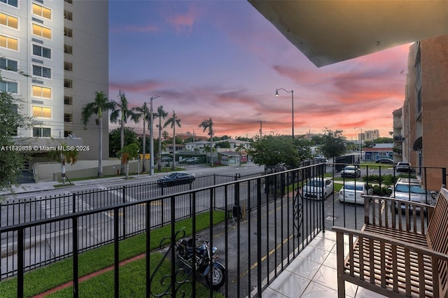 view of balcony at dusk