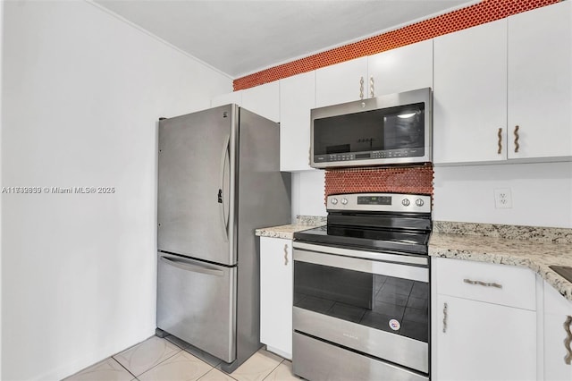 kitchen featuring appliances with stainless steel finishes and white cabinets