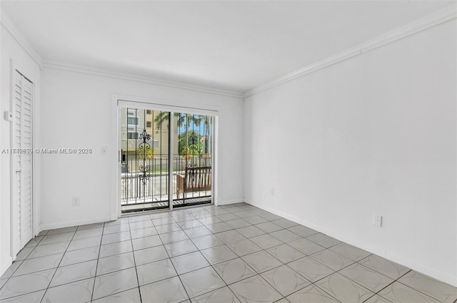 unfurnished room featuring crown molding and light tile patterned flooring