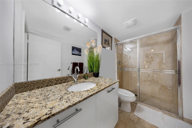 bathroom featuring walk in shower, vanity, and toilet